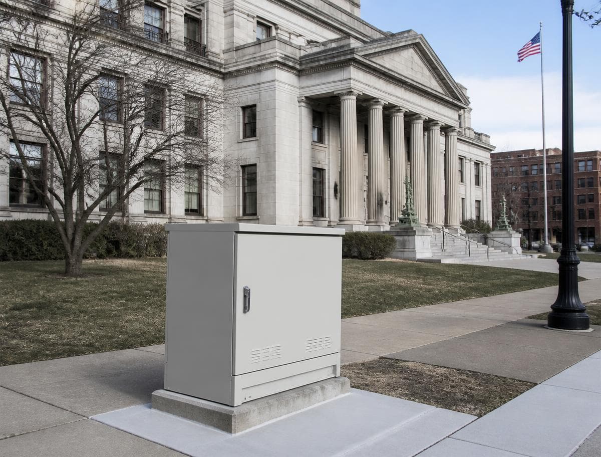 Fiber distribution cabinet on the sidewalk outside a municipal city hall