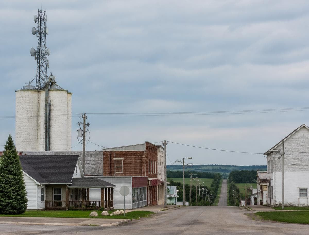 Small rural main street with a fixed wireless antenna mounted on a grain silo